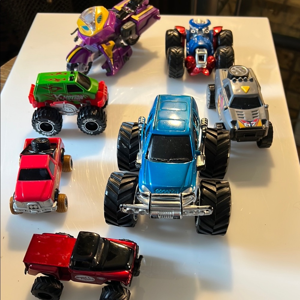 Lot of 7 Monster trucks and a toy motorcycle different brands $20 OBO